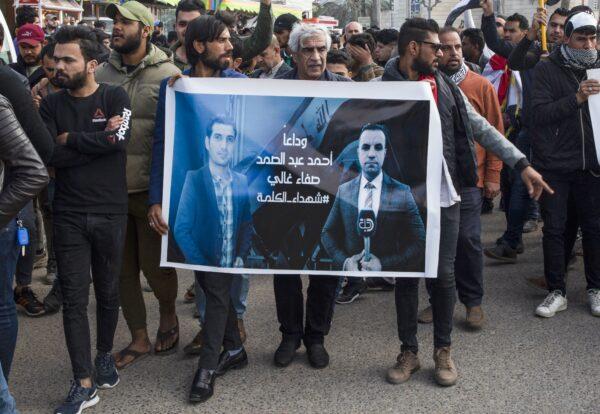 Iraqis take part in a rally on Jan. 11, 2020, to mourn two reporters (image) shot dead the previous evening in the country's southern city of Basra, where they had been covering months of anti-government protests. (HUSSEIN FALEH/AFP via Getty Images)