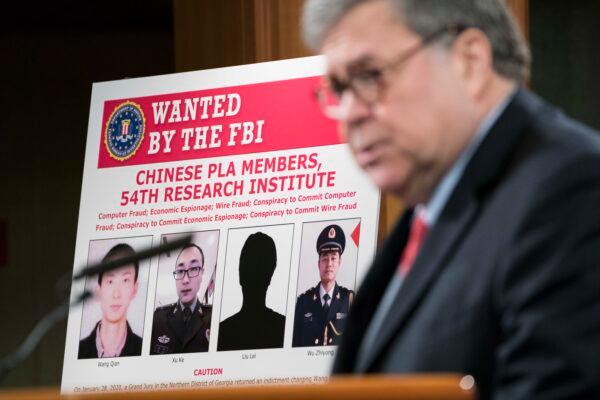 U.S. Attorney General William Barr participates in a press conference at the Department of Justice (DOJ) along with DOJ officials in Washington on Feb. 10, 2020. (Sarah Silbiger/Getty Images)