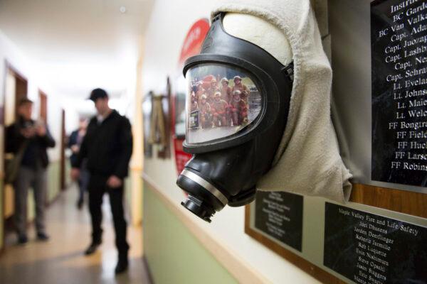 A self-contained breathing apparatus and a photo of recruits inside a Washington State Patrol Fire Training Academy dormitory which has been designated as a Novel Coronavirus quarantine site, in Washington on Feb. 6, 2020. (Jason Redmond/AFP via Getty Images)