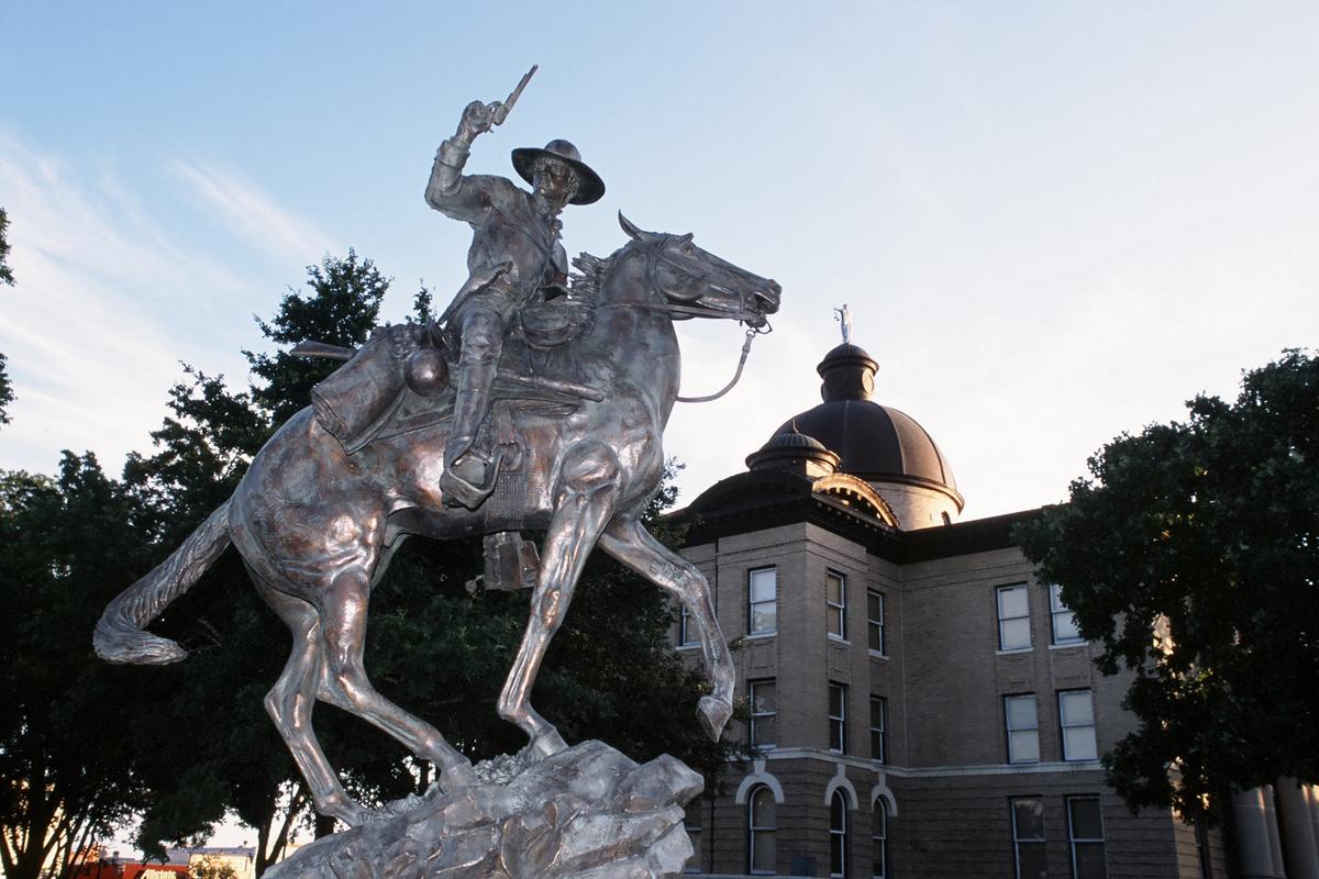 Two things you can't miss in San Marcos's downtown square: the Texas Ranger Capt. John Coffee “Jack” Hays statue and the historic Hays County Courthouse. (Courtesy of Greater San Marcos Partnership Library)