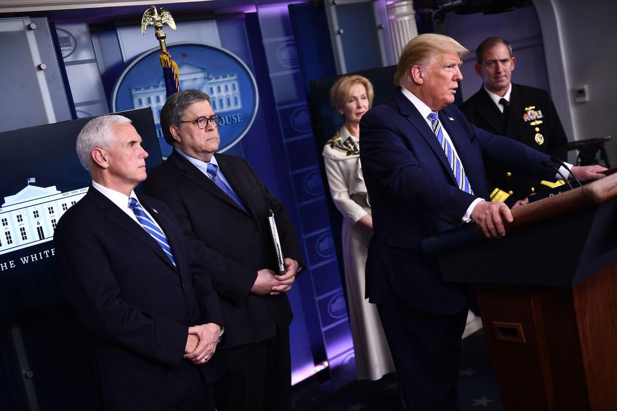 President Donald Trump and officials attend the daily briefing on the CCP virus at the White House in Washington on March 23, 2020. (Brendan Smialowski/AFP via Getty Images)