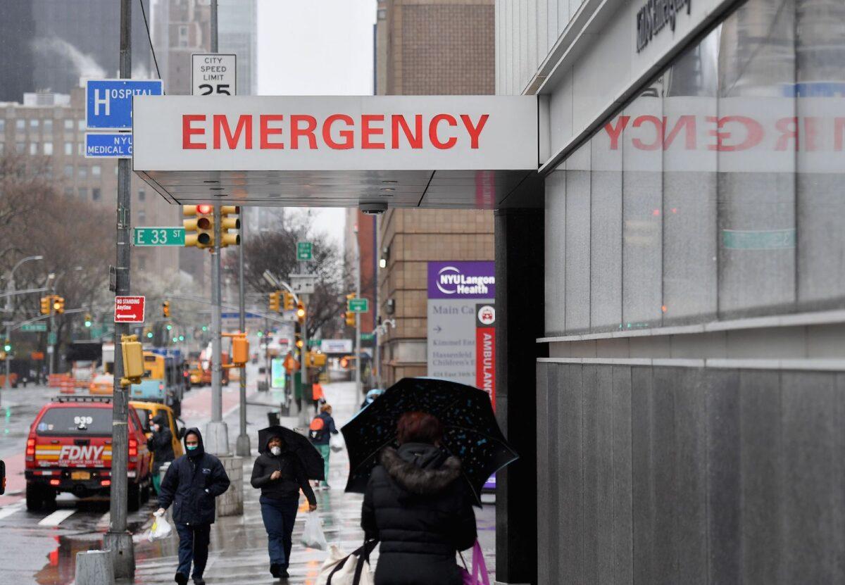 A sign is seen at the NYU Langone Health Center hospital emergency room entrance on March 23, 2020 in New York City. (Angela Weiss/AFP via Getty Images)