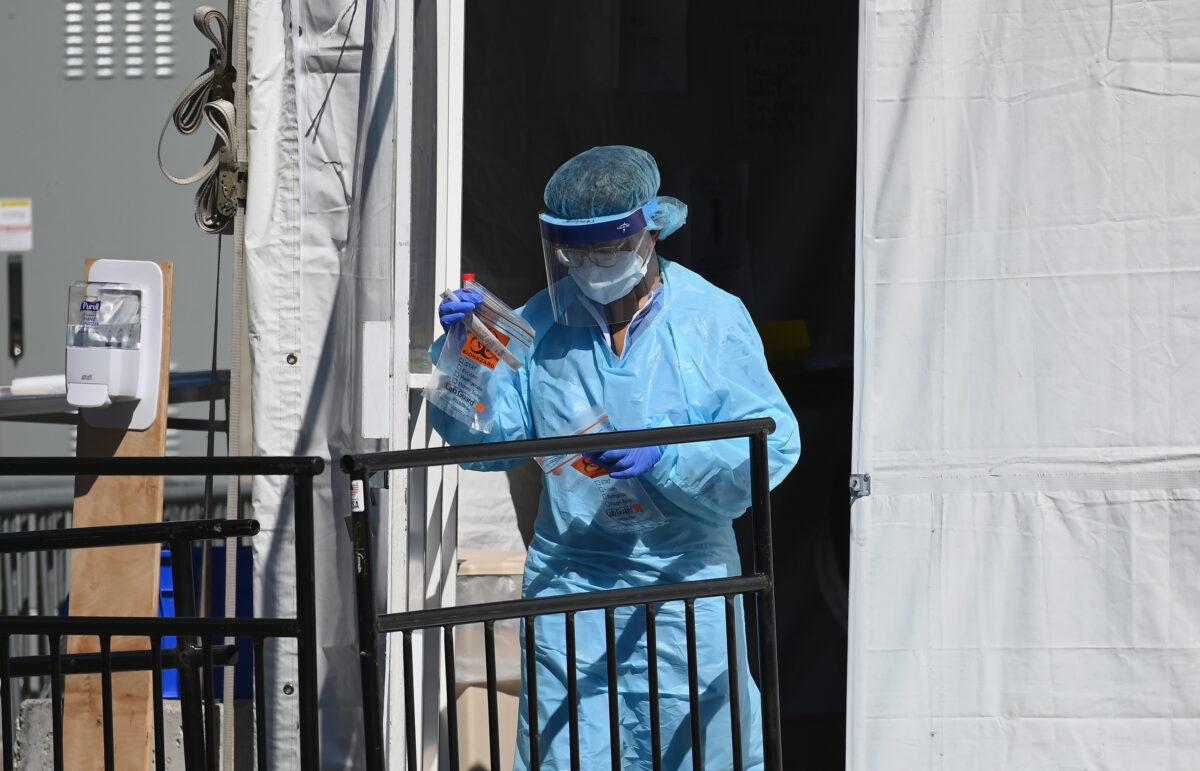 A medical worker walks out of a CCP virus testing tent at Brooklyn Hospital Center in New York City on March 27, 2020. (Angela Weiss/AFP via Getty Images)