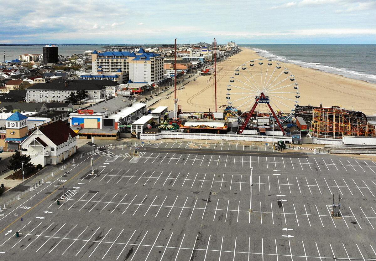 An aerial view from a drone shows an empty parking lot and beach in Ocean City, Maryland on April 27, 2020. The beach and boardwalk were closed after Maryland Governor Larry Hogan issued a stay-at-home order and banned non-essential travel to slow the spread of the CCP virus. (Mark Wilson/Getty Images)