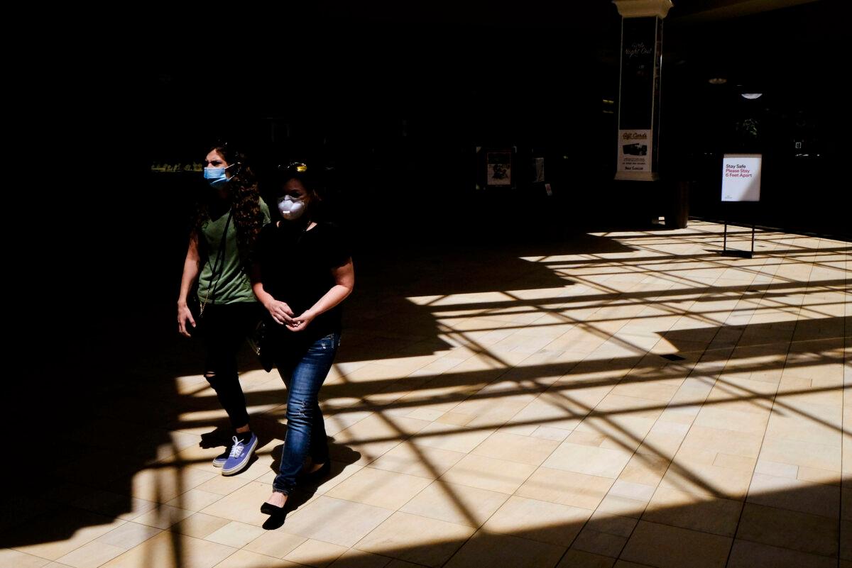 Shoppers walk inside of the Greenwood Park Mall in Greenwood, Ind. on May 4, 2020. (Darron Cummings/AP Photo)
