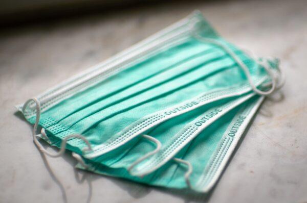 Stock photo of surgical face masks. (Mika Baumeister/Unsplash)