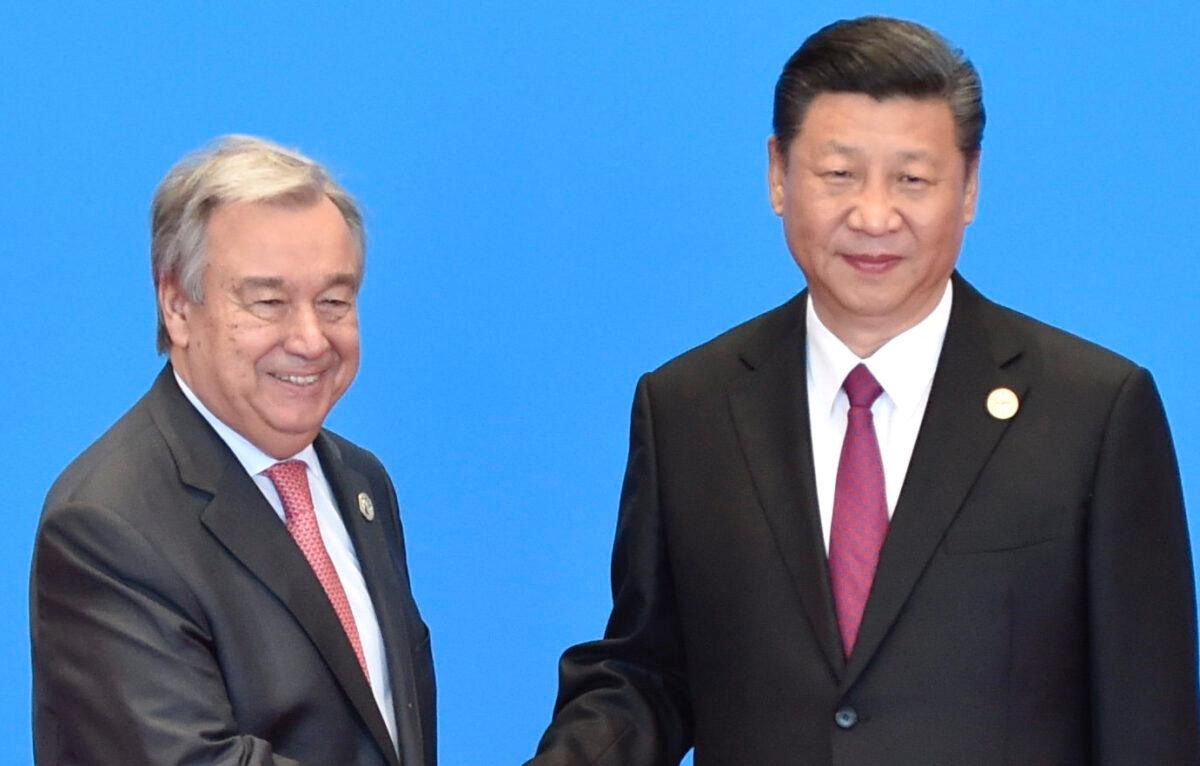 U.N. Secretary General Antonio Guterres (left) shakes hands with Chinese leader Xi Jinping during the welcome ceremony for the Belt and Road Forum in Beijing on May 15, 2017. (Kenzaburo Fukuhara/Pool/Getty Images)