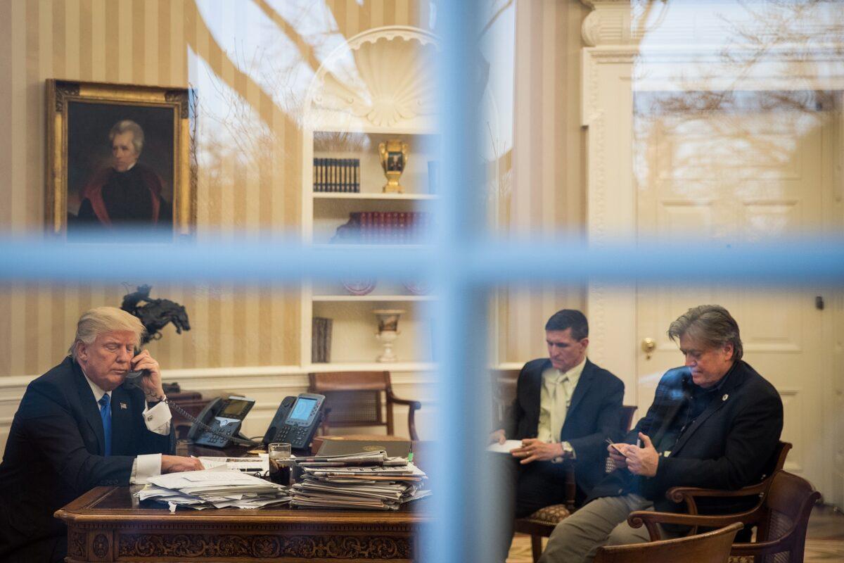 President Donald Trump in the White House with National Security Adviser Michael Flynn (C) and chief strategist Steve Bannon (R). (Drew Angerer/Getty Images)
