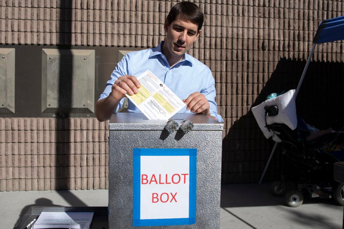 Then-Democratic candidate for California's 10th Congressional District Josh Harder places his ballot inside a ballot box at a polling station in Modesto, Calif., on Nov. 6, 2018. (Alex Edelman/Getty Images)