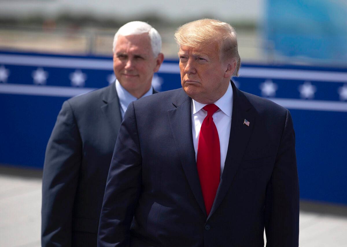 President Donald Trump, right, and Vice President Mike Pence wait on the rooftop of the Operational Building at NASA before the launch of the SpaceX Falcon 9 rocket with NASA astronauts Bob Behnken and Doug Hurley aboard the rocket from the Kennedy Space Center in Cape Canaveral, Fla., on May 30, 2020. (Saul Martinez/Getty Images)