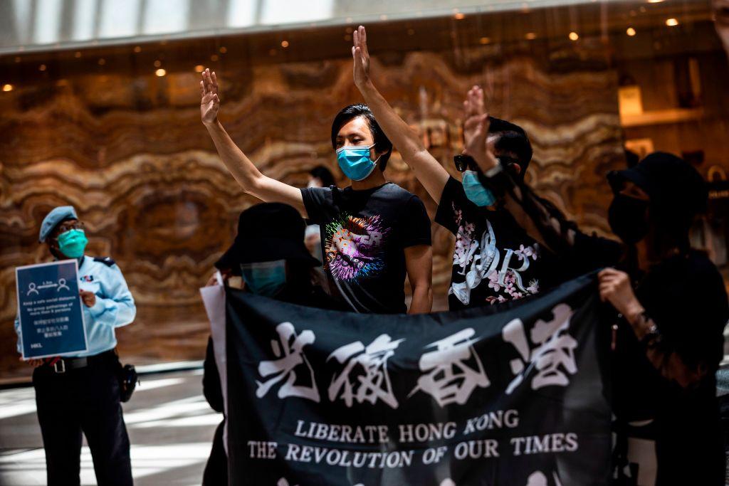 Pro-democracy protesters gather during a "Lunch With You" rally at a shopping mall in the Central district of Hong Kong on June 1, 2020. (Issac Lawrence/AFP via Getty Images)
