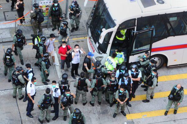 Protesters are arrested by local police in Mong Kok, Hong Kong, on June 28, 2020. (Song Bilung/The Epoch Times)