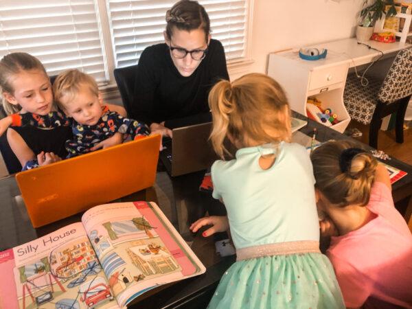 Adrienne Schweer (C) tries to do her job and simultaneously help her four children with distance learning during the pandemic, at home in Fairfax, Va. (Photo courtesy of Adrienne Schweer)