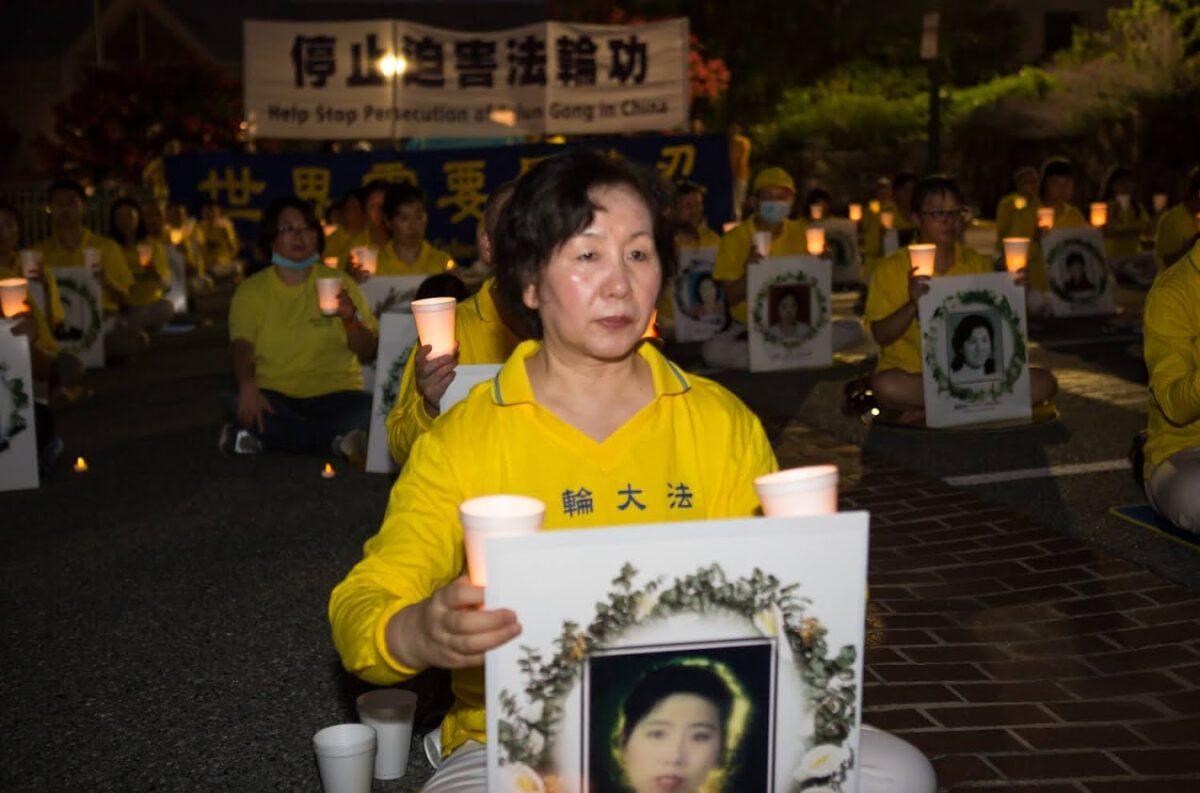 Wang Chunyan participates in a candlelight vigil outside the Chinese Embassy in Washington on July 17, 2020. (Lisa Fan/The Epoch Times)