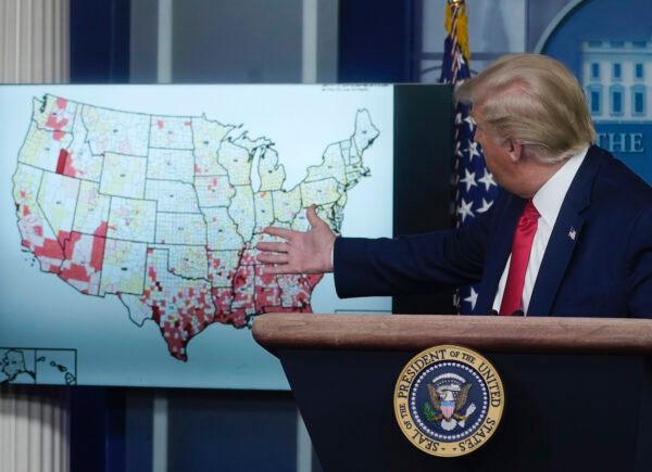 President Donald Trump looks at a map while speaking during a news conference at the White House in Washington, on July 23, 2020. (Drew Angerer/Getty Images)