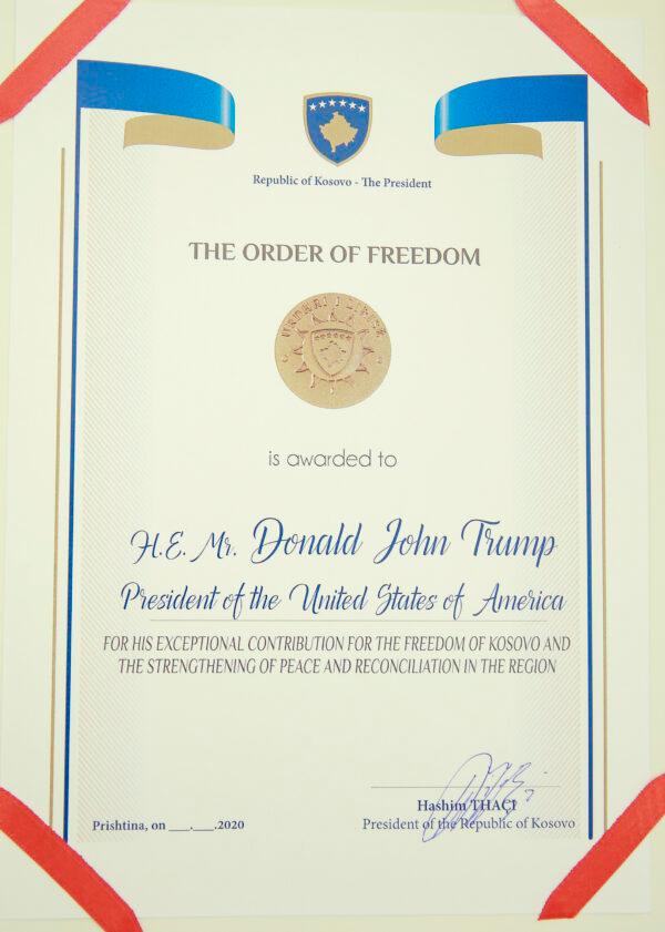 A photo of the Order of Freedom awarded to the U.S. President Donald Trump, undersigned by Kosovo's President Hashim Thaci in capital Pristina, on Sept. 18, 2020. (Visar Kryeziu/AP Photo)