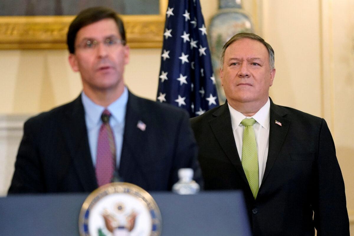 U.S. Secretary of State Mike Pompeo listens as Defense Secretary Mark Esper speaks during a news conference to announce the Trump administration's restoration of sanctions on Iran, at the U.S. State Department in Washington, on Sept. 21, 2020. (Patrick Semansky/Pool via Reuters)
