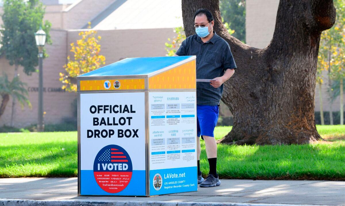 A ballot is dropped off at an official ballot drop box in Monterey Park, Calif., on Oct. 5, 2020. (Frederic J. Brown/AFP via Getty Images)