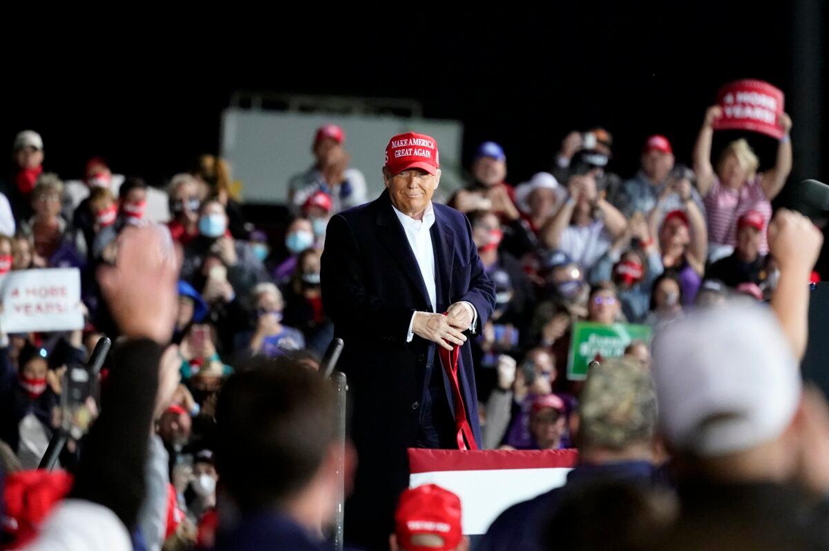 President Donald Trump listens to supporters during a campaign rally at Des Moines International Airport, in Des Moines, Iowa, on Oct. 14, 2020. (Alex Brandon/AP Photo)