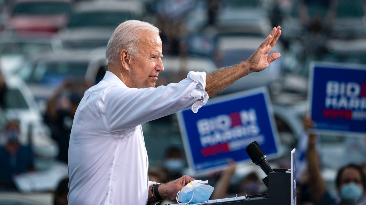 Democratic presidential nominee Joe Biden waves to supporters as he finishes speaking during a drive-in campaign rally in the parking lot of Cellairis Ampitheatre in Atlanta, Ga., on Oct. 27, 2020. (Drew Angerer/Getty Images)