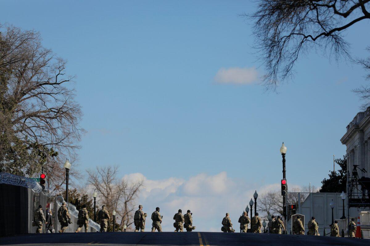 Members of the National Guard patrol near the U.S. Capitol building ahead of President-elect Joe Biden's inauguration, in Washington on Jan. 19, 2021. (Andrew Kelly/Reuters)