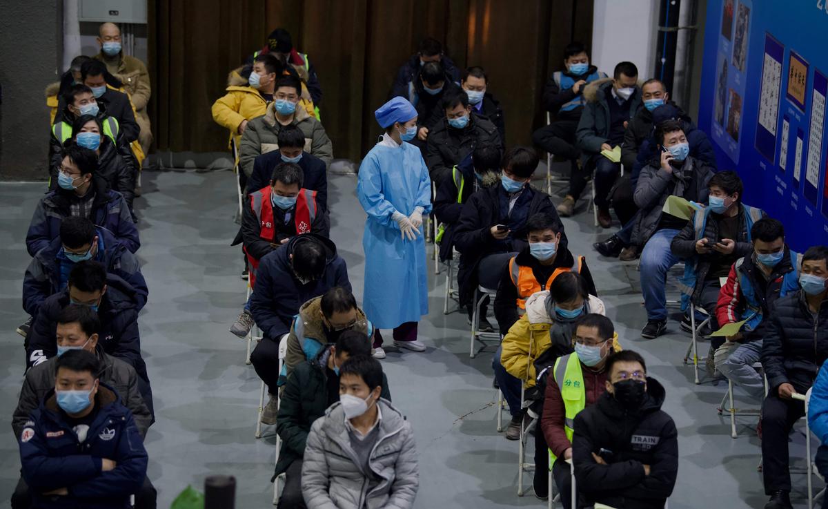 People wait to be inoculated with a COVID-19 vaccine at the Chaoyang Museum of Urban Planning in Beijing, China, on Jan. 15, 2021. (Noel Celis/AFP via Getty Images)