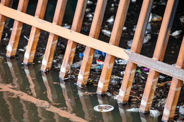 Trash litters the water near a storm drain in the Venice Beach area of Los Angeles on Jan. 27, 2021. (John Fredricks/The Epoch Times)