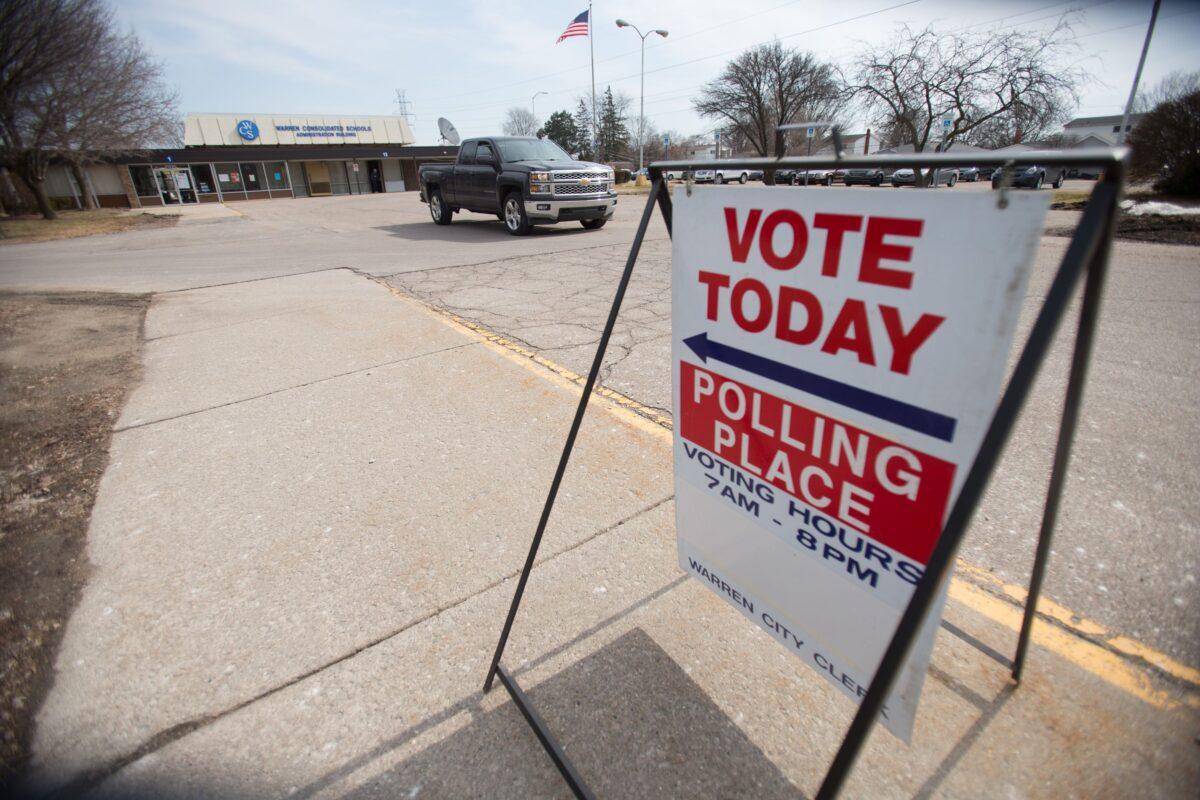 A truck leaves a polling place in Warren, Mich., on March 8, 2016. (Geoff Robins/AFP via Getty Images)