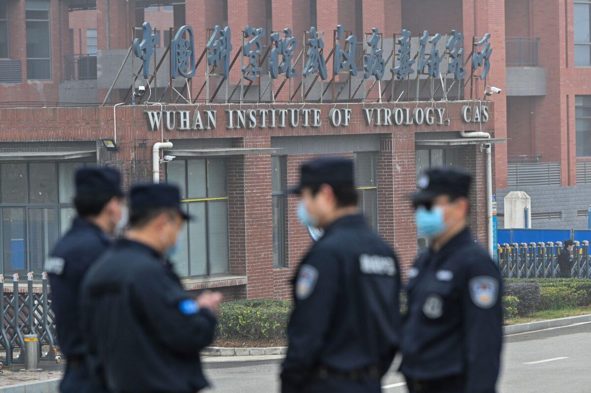 Security personnel stand guard outside the Wuhan Institute of Virology in Wuhan in Wuhan, China, on Feb. 3, 2021. (Hector Retamal /AFP via Getty Images)