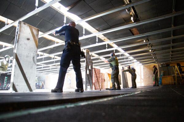 Police officers fire weapons at the Orange County Sheriff's Department shooting range in Orange, Calif., on March 30, 2021. (John Fredricks/The Epoch Times)