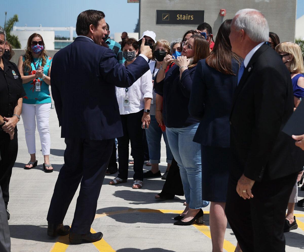 Florida Gov. Ron DeSantis gives a thumbs up as he leaves a press conference where he spoke about the cruise industry at the Port of Miami on April 8, 2021. (Joe Raedle/Getty Images)