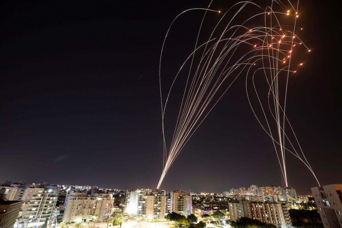Streaks of light are seen as Israel's Iron Dome anti-missile system intercepts rockets launched from the Gaza Strip towards Israel, as seen from Ashkelon, Israel, on May 11, 2021. (Nir Elias/Reuters)