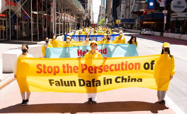 Practitioners of the spiritual discipline Falun Gong hold a parade in New York on May 13, 2020, to celebrate World Falun Dafa Day and to protest the ongoing persecution of the group by the Chinese Communist Party in China. (Larry Dai/The Epoch Times)