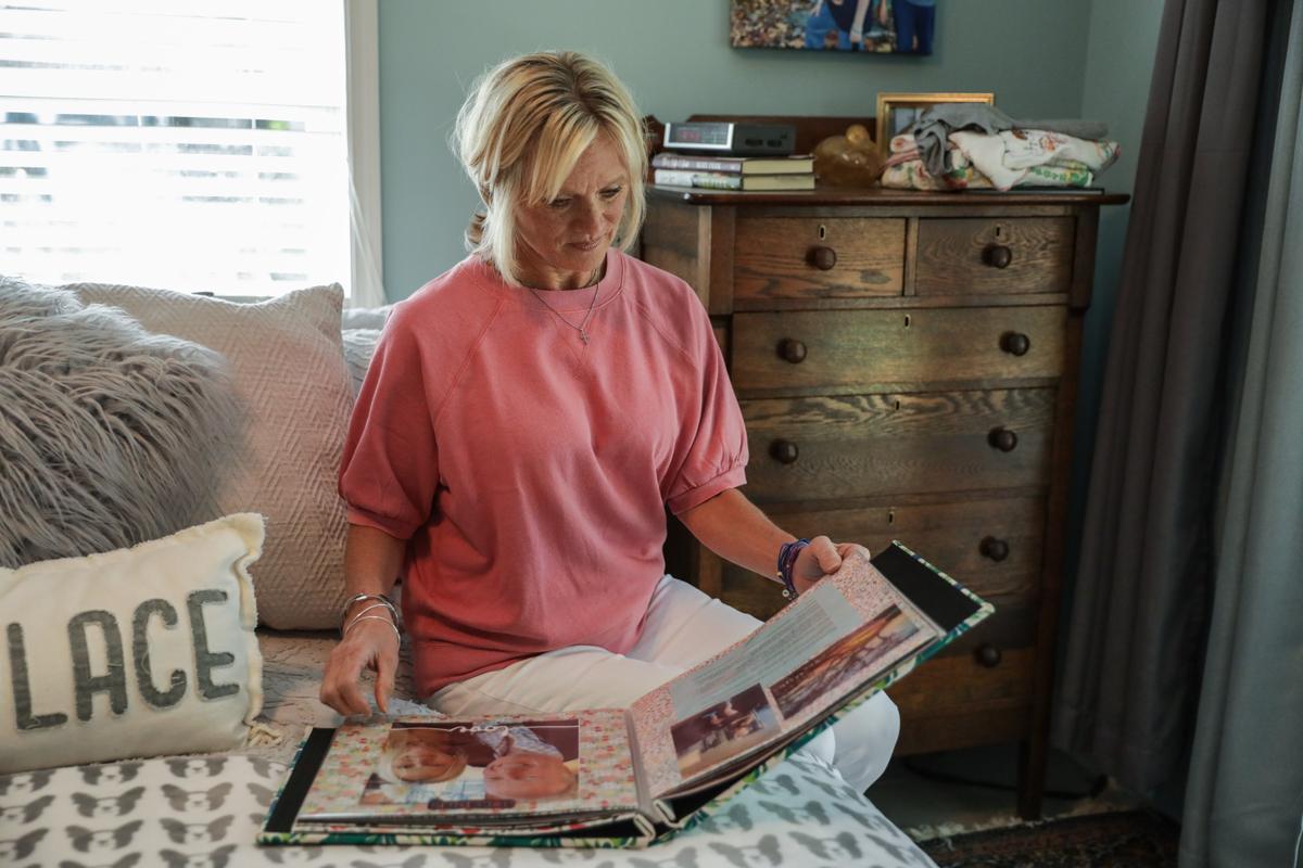 Michele Holbrook looks at photos of her son Chandler Cook, who died of an overdose, at her home in Fernandina Beach, Fla., on May 19, 2021. (Samira Bouaou/The Epoch Times)