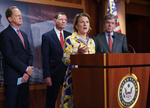Sen. Shelley Moore Capito (R-W.Va.), speaks at a news conference, joined (from left) by Sens. Pat Toomey (R-Pa.), John Barrasso (R-Wyo.), and Roy Blunt (R-Mo.), at the Capitol in Washington on May 27, 2021. (J. Scott Applewhite/AP Photo)