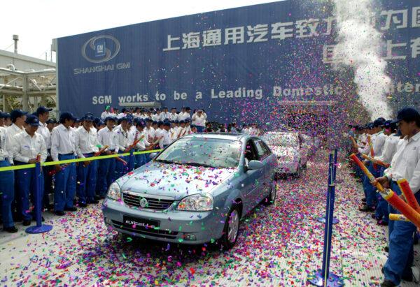 Buick Excelles are displayed during the opening ceremony of the Jinqiao South Vehicle Plant of Shanghai General Motors Corp. in Shanghai, China, on May 28, 2005. (China Photos/Getty Images)