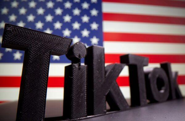 A 3D printed Tik Tok logo is seen in front of the U.S. flag on Oct. 6, 2020. (Dado Ruvic/Reuters)