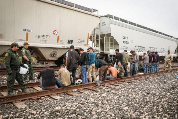 Border Patrol agents apprehends 21 illegal aliens from Mexico who had hidden in a grain hopper on a freight train heading to San Antonio, near Uvalde, Texas, on June 21, 2021. (Charlotte Cuthbertson/The Epoch Times)