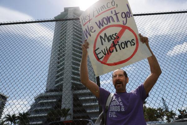 Tenants of the Hamilton on the Bay apartment building protest eviction notices in Miami on June 8, 2021. (Joe Raedle/Getty Images)