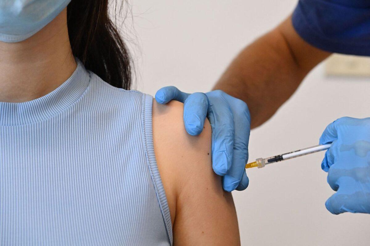 A woman is vaccinated against COVID-19 at a Poliambulatorio Health Canter in the southern Italian Pelagie Island of Lampedusa on May 15, 2021. (Alberto Pizzoli/ AFP via Getty Images)