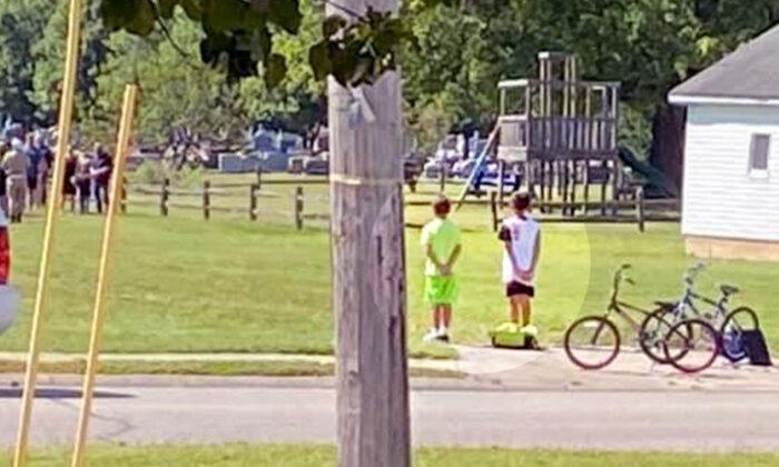 2 Indiana Boys on Bikes See Military Funeral and Stop to Pay Respects as Taps Plays