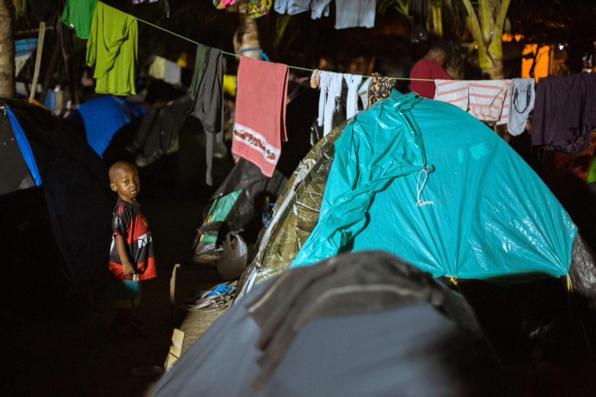 A child in a migrant camp in Necocli, Colombia, on Oct. 12, 2021. (Alejandro Gomez for The Epoch Times)