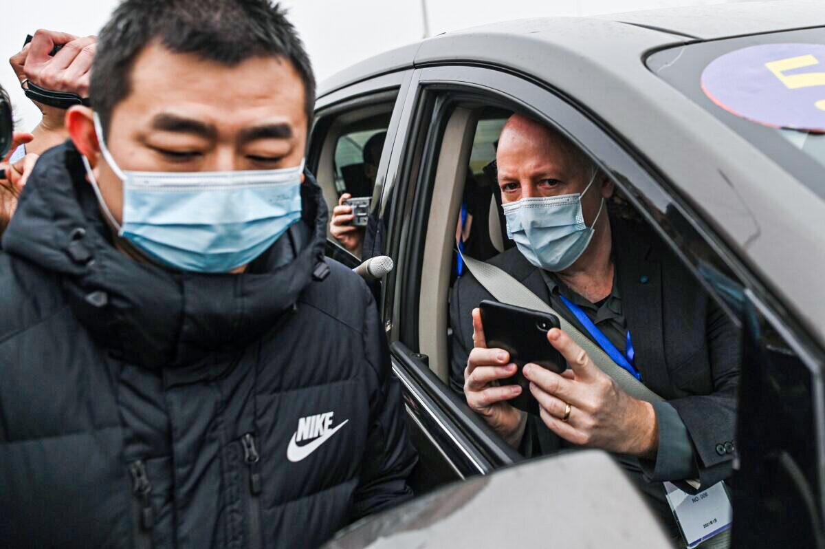 Peter Daszak, right, the president of the EcoHealth Alliance, in Wuhan, China, on Feb. 3, 2021. (Hector Retamal/AFP via Getty Images)