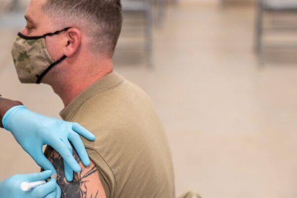 A soldier receives a COVID-19 vaccine from Army Preventative Medical Services in Fort Knox, Ky., on Sept. 9, 2021. (Jon Cherry/Getty Images)