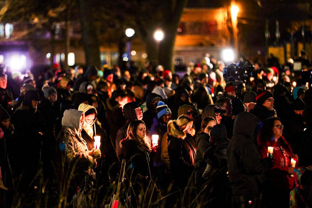 People attend a candlelight vigil in Cutler Park in Waukesha, Wis., on Nov. 22, 2021. (Mustafa Hussain/AFP via Getty Images)