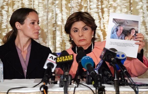 Attorney Gloria Allred (R) and her client Teala Davies, who claims to have been a victim of sexual abuse by Jeffrey Epstein when she was a minor, at a press conference to announce a lawsuit against Epstein's estate, in New York on Nov. 21, 2019. (TIMOTHY A. CLARY/AFP via Getty Images)