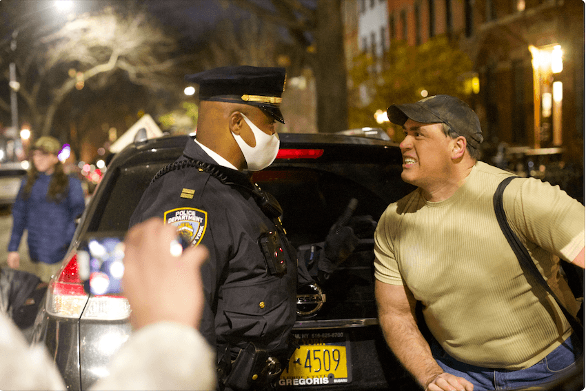 Police getting protesters out of the road outside Bill de Blasio's residence in Brooklyn, New York, on Dec. 8, 2021. (Enrico Trigoso/The Epoch Times)