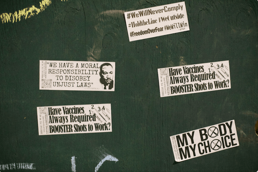 Stickers on the entrance outside Bill de Blasio's residence in Brooklyn, New York, on Dec. 8, 2021. (Enrico Trigoso/The Epoch Times)