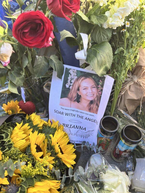 Dozens of friends, co-workers, and Hancock Park residents held a vigil for Brianna Kupfer, a 24-year-old UCLA graduate student, outside of a furniture store in Los Angeles on Jan. 20, 2022. (The Epoch Times)