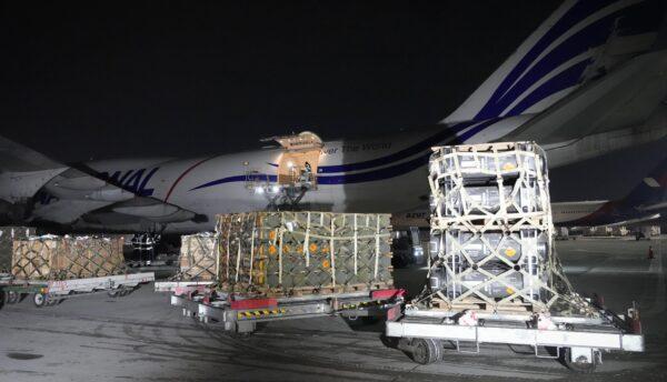 Workers unload a shipment of military aid delivered as part of the U.S. security assistance to Ukraine, at the Boryspil airport, outside Kyiv, on Jan. 25, 2022. (Efrem Lukatsky/file/AP Photo)